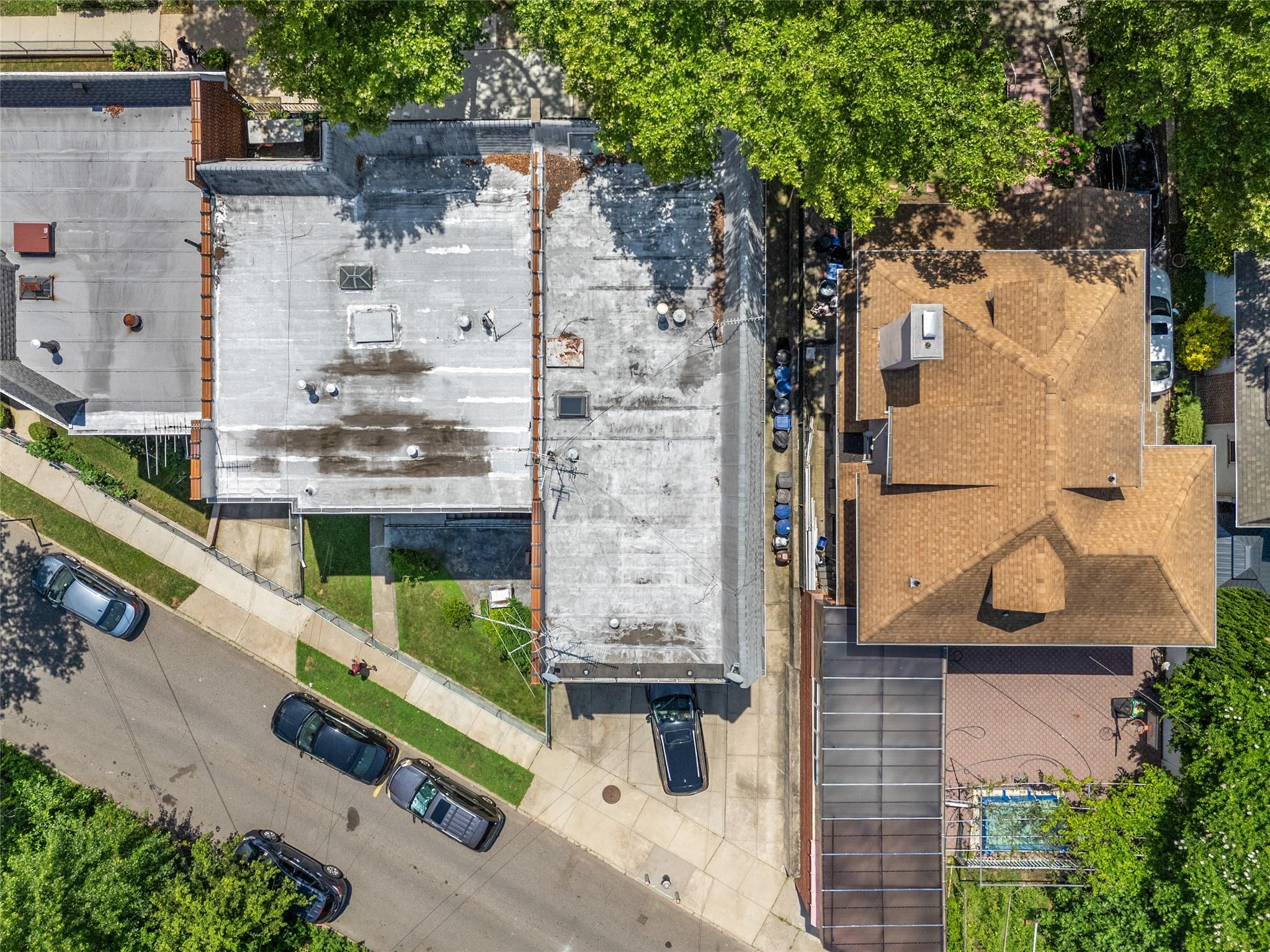 85-45 Abingdon Road Queens, NY 11415 - Photo 6 of 13 an aerial view of residential house with outdoor space and parking