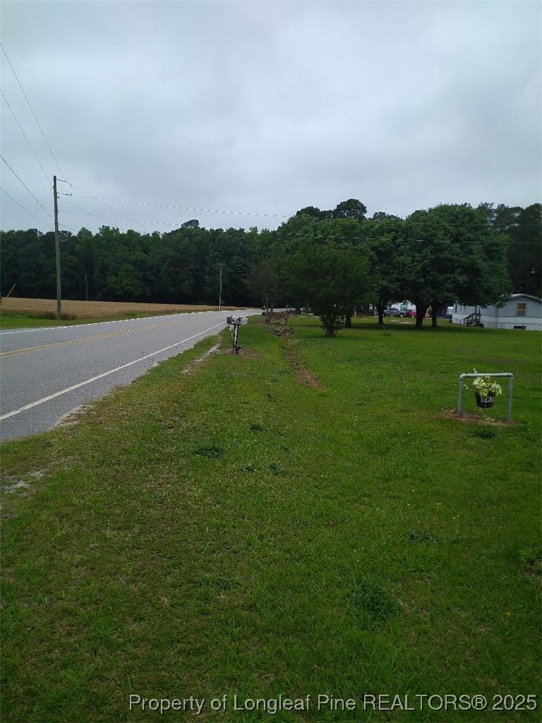 887 Stephens Road Lumberton, NC 28358 - Photo 2 of 9 a view of a golf course with a lake