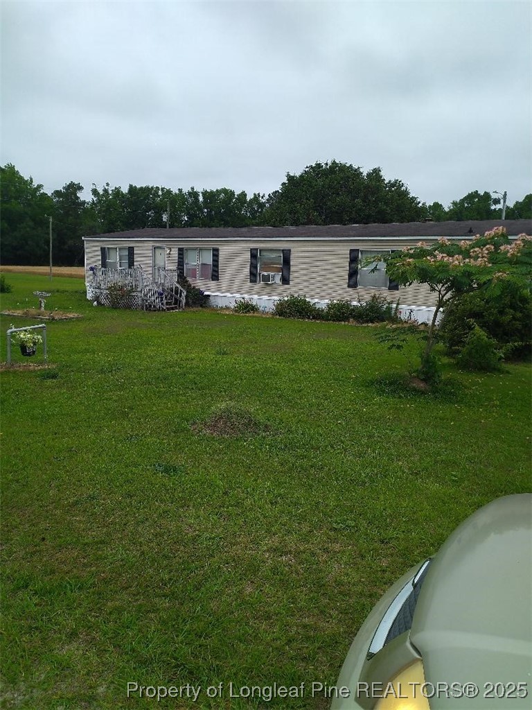 887 Stephens Road Lumberton, NC 28358 - Photo 5 of 9 a view of a lake with houses in the back