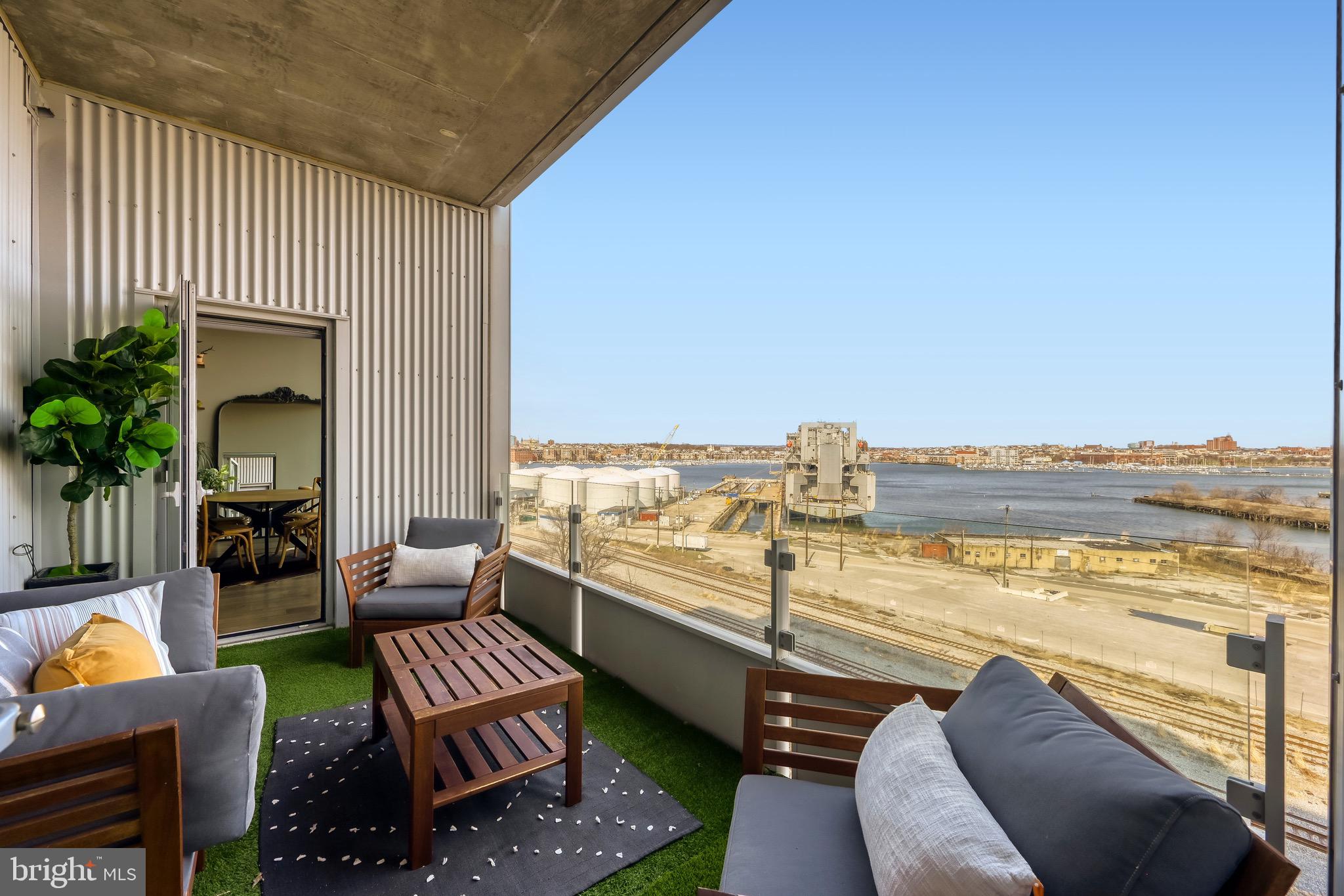 1200 Steuart Street, Unit 713 Baltimore, MD 21230 - Photo 27 of 43 a view of a balcony with chairs