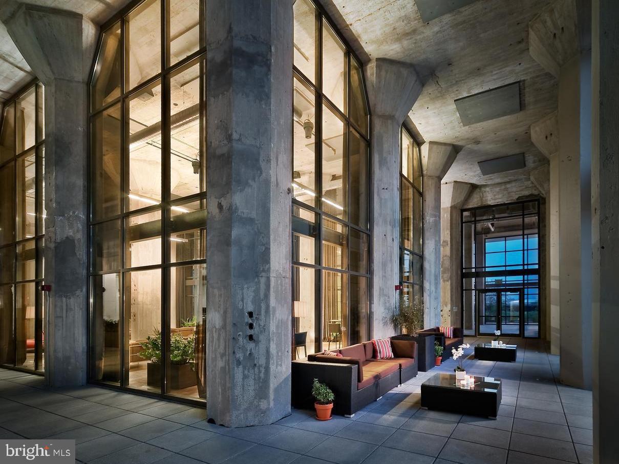 1200 Steuart Street, Unit 713 Baltimore, MD 21230 - Photo 5 of 15 a building outdoor space with patio furniture and potted plants