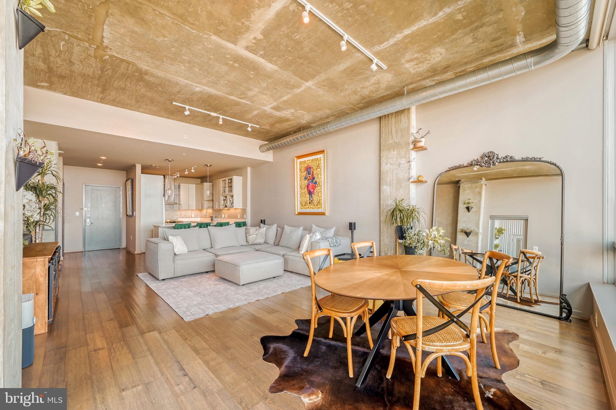 1200 Steuart Street, Unit 713 Baltimore, MD 21230 - Photo 8 of 43 a dining room with furniture and wooden floor
