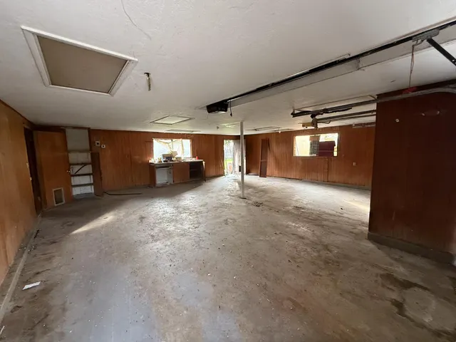 a view of empty room with a fireplace