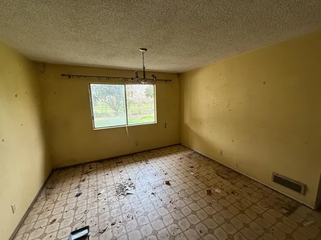 a view of an empty room and window