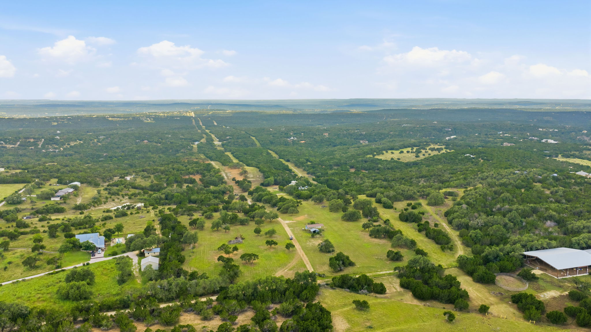 3230 West Fitzhugh Road Dripping Springs, TX 78620 - Photo 29 of 34 Acres of verdant land unfold, offering vast open spaces and panoramic views for your private estate.