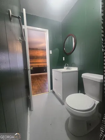 a bathroom with a sink and mirror
