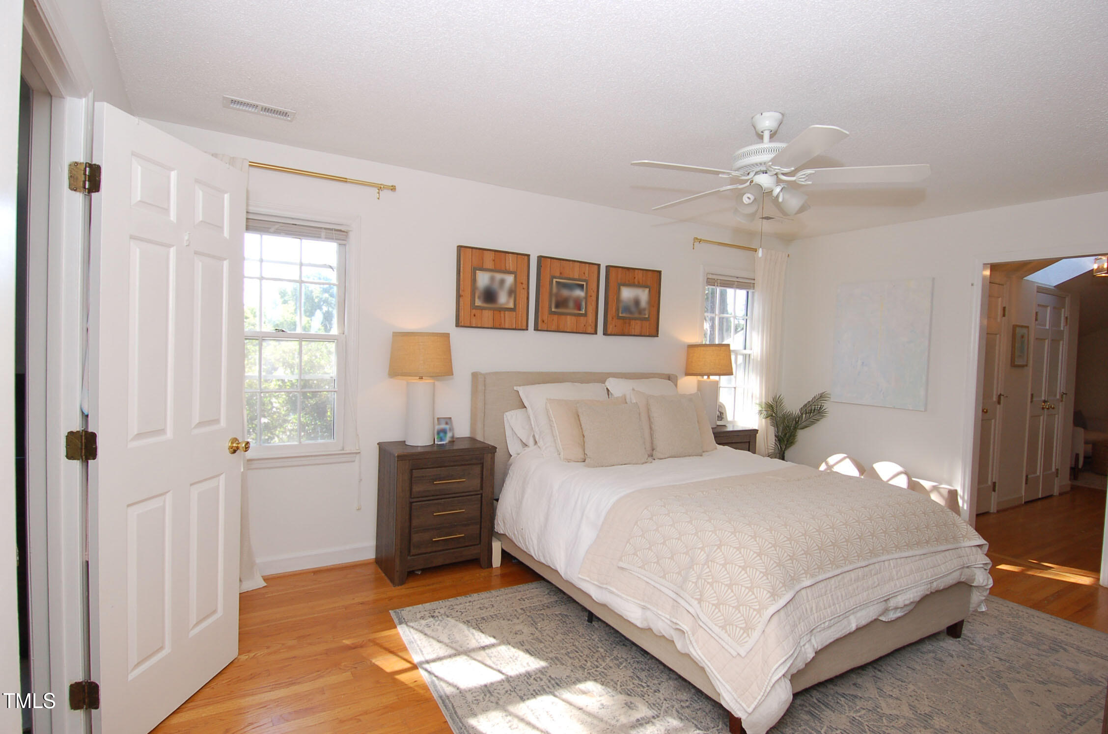 3414 Bellevue Road Raleigh, NC 27609 - Photo 10 of 20 a bedroom with a large bed and a window