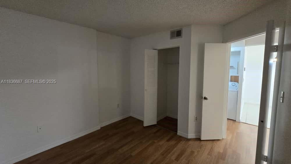 301 Palm Way, Unit 205 Pembroke Pines, FL 33025 - Photo 12 of 23 a view of a hallway with wooden floor