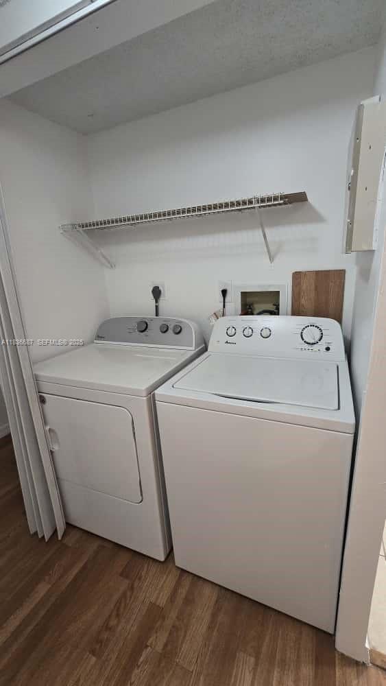 301 Palm Way, Unit 205 Pembroke Pines, FL 33025 - Photo 17 of 23 a utility room with dryer and washer