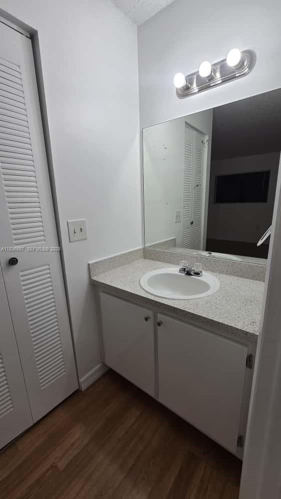 301 Palm Way, Unit 205 Pembroke Pines, FL 33025 - Photo 18 of 23 a bathroom with a sink and a mirror