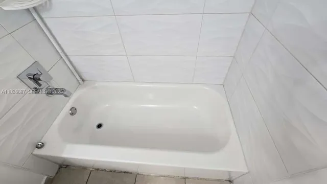 a bathroom with a white bath tub