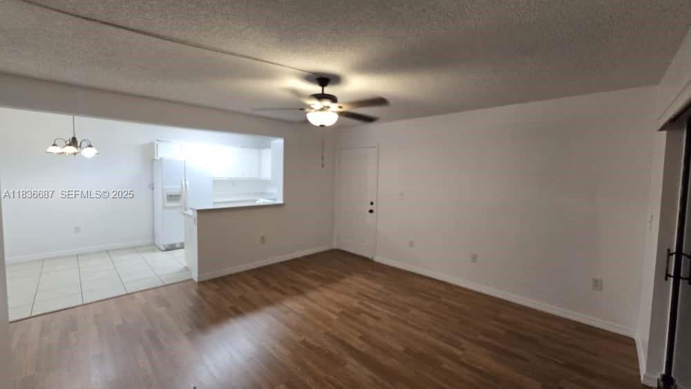 301 Palm Way, Unit 205 Pembroke Pines, FL 33025 - Photo 4 of 23 wooden floor in an empty room with a window