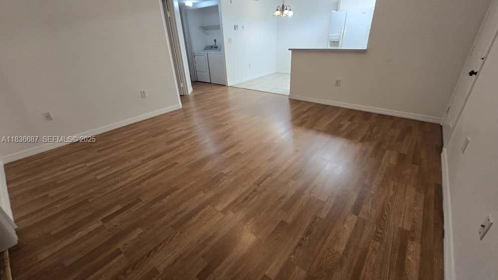 301 Palm Way, Unit 205 Pembroke Pines, FL 33025 - Photo 5 of 23 wooden floor in an empty room