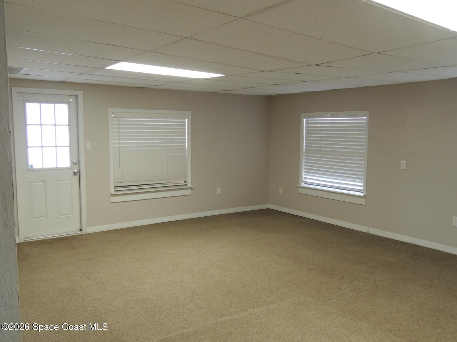 1312 Huntington Lane Rockledge, FL 32955 - Photo 8 of 21 a view of a room that has a window in it