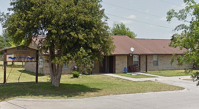1200 Goliad Street Runge, TX 78151 - Photo 2 of 6 a view of a house with a yard