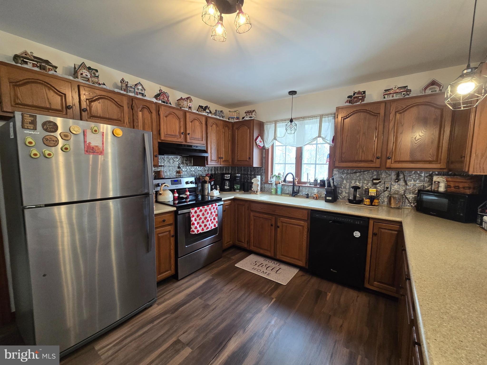 3 White Oak Road Fleetwood, PA 19522 - Photo 13 of 48 a kitchen with stainless steel appliances granite countertop a refrigerator a stove a sink and a microwave