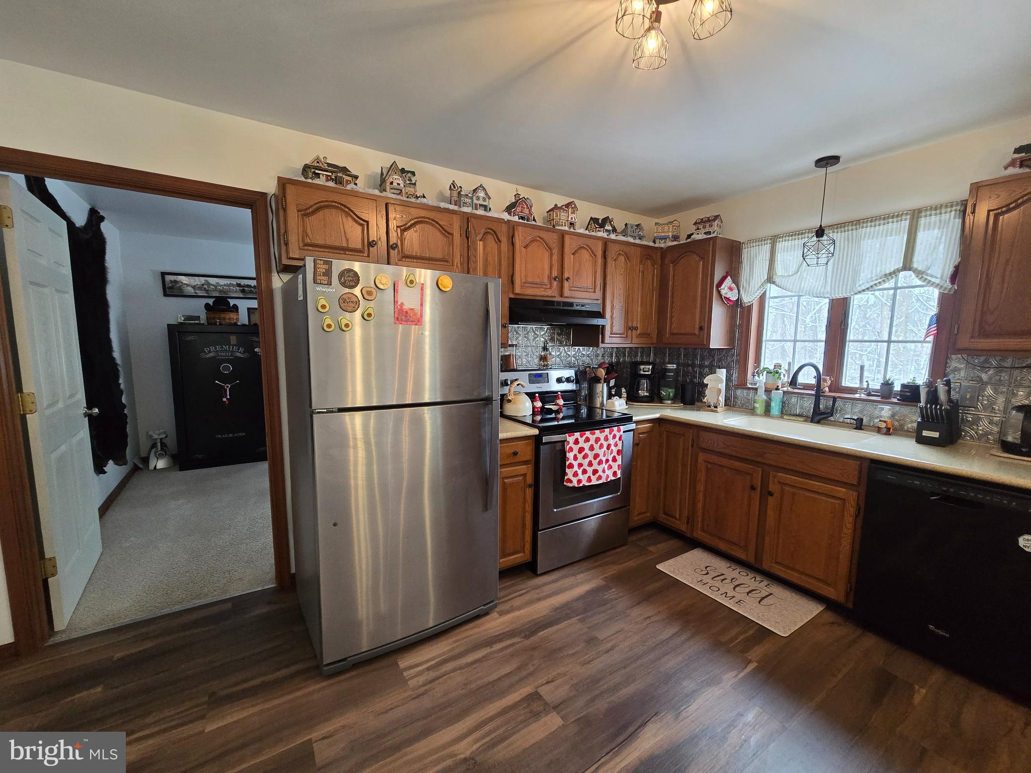 3 White Oak Road Fleetwood, PA 19522 - Photo 15 of 48 a kitchen with stainless steel appliances granite countertop a refrigerator a stove and a sink with wooden floor