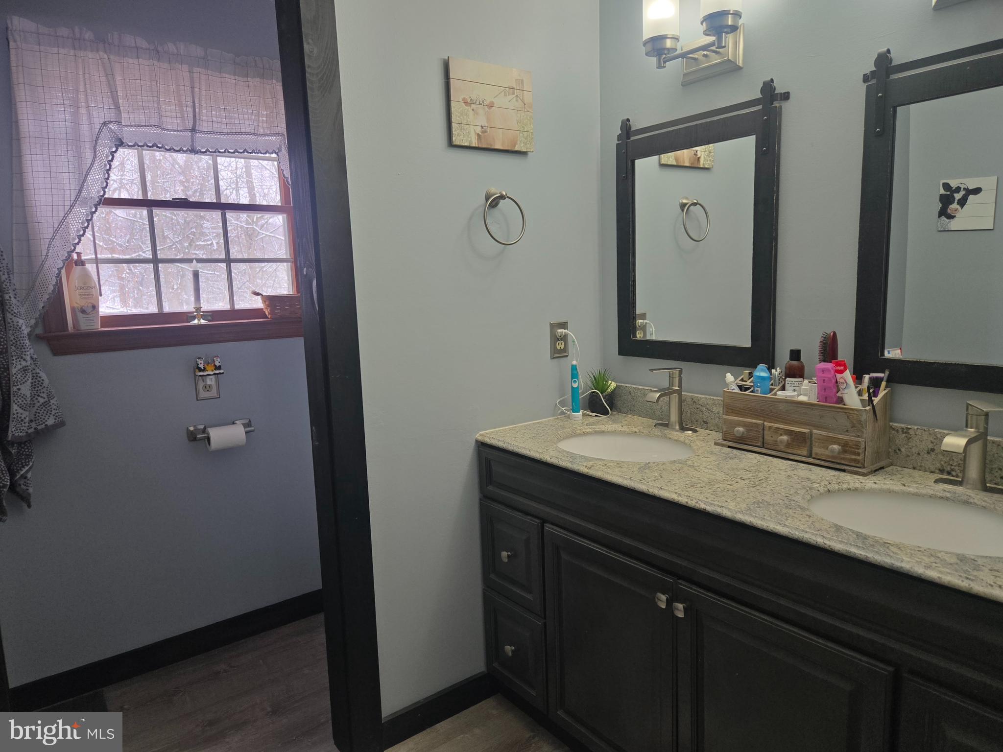 3 White Oak Road Fleetwood, PA 19522 - Photo 29 of 48 a bathroom with a granite countertop sink a large mirror a and window