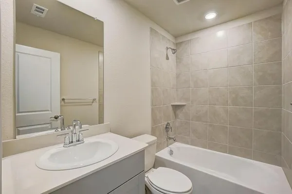 a bathroom with a sink toilet a bathtub and shower