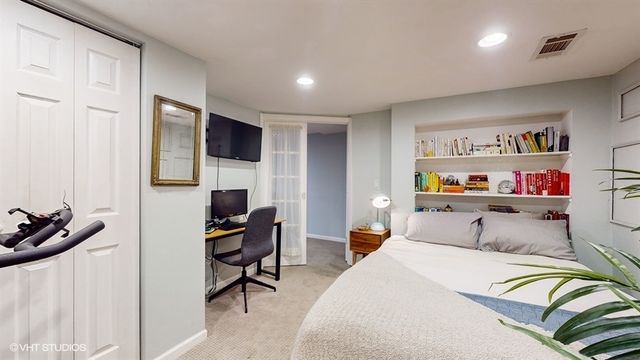 a bedroom with a bed and furniture