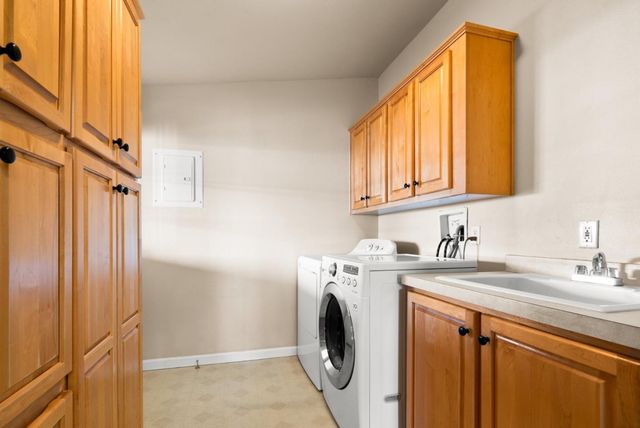 a utility room with window washer and dryer