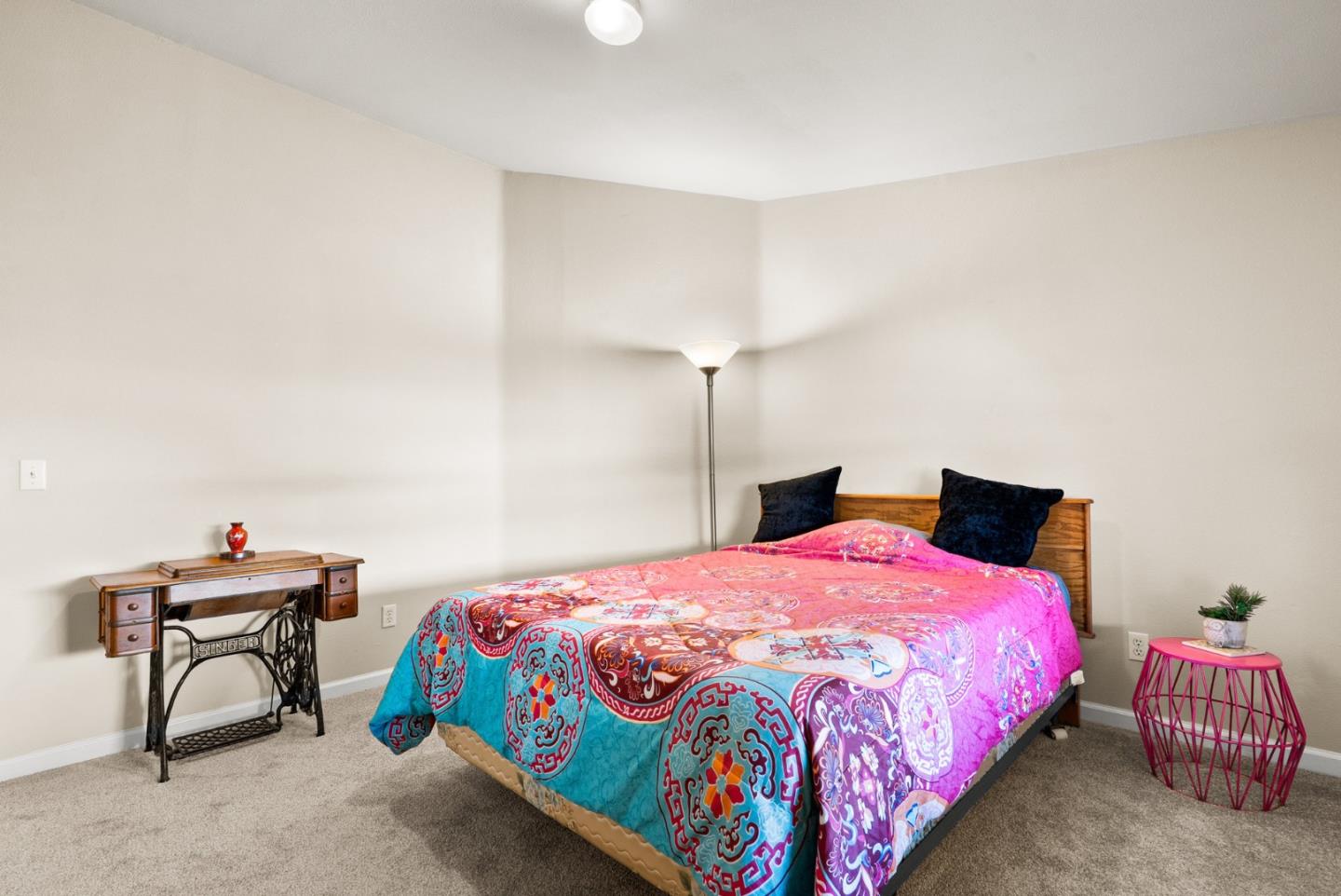 225 Mt Hermon Road, Unit 199 Scotts Valley, CA 95066 - Photo 25 of 44 a bedroom with a bed and a chandelier