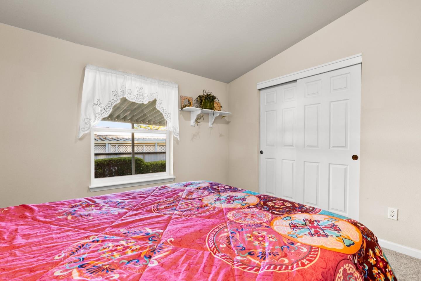 225 Mt Hermon Road, Unit 199 Scotts Valley, CA 95066 - Photo 26 of 44 a bedroom with a bed and a window
