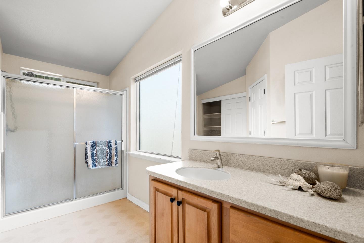 225 Mt Hermon Road, Unit 199 Scotts Valley, CA 95066 - Photo 32 of 44 a bathroom with a granite countertop sink and a mirror