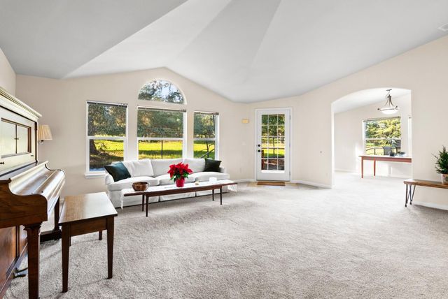a living room with furniture and windows