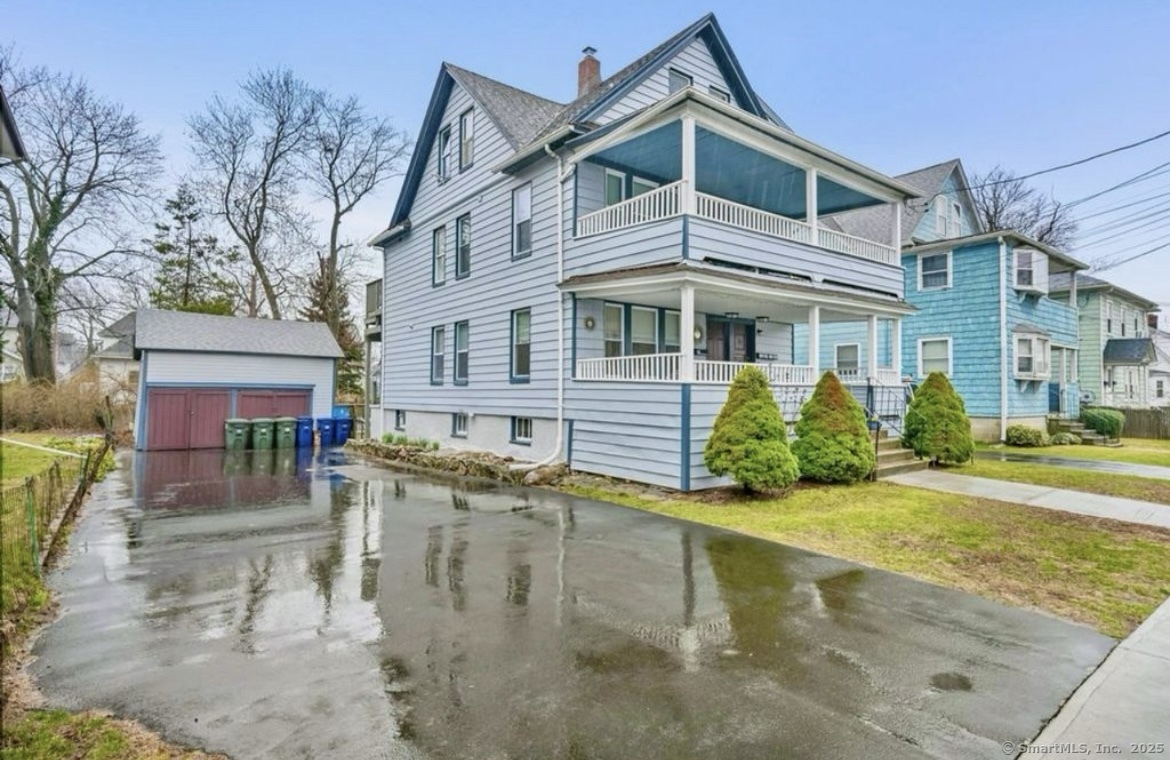 115 Harborview Avenue, Unit 1 Bridgeport, CT 06605 - Photo 1 of 11 a view of a house with a patio
