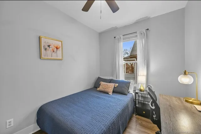 a bed room with a bed and a chandelier