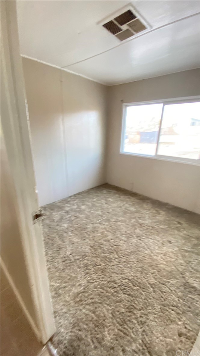 20455 Hunter Street Perris, CA 92570 - Photo 19 of 35 a view of an empty room and window