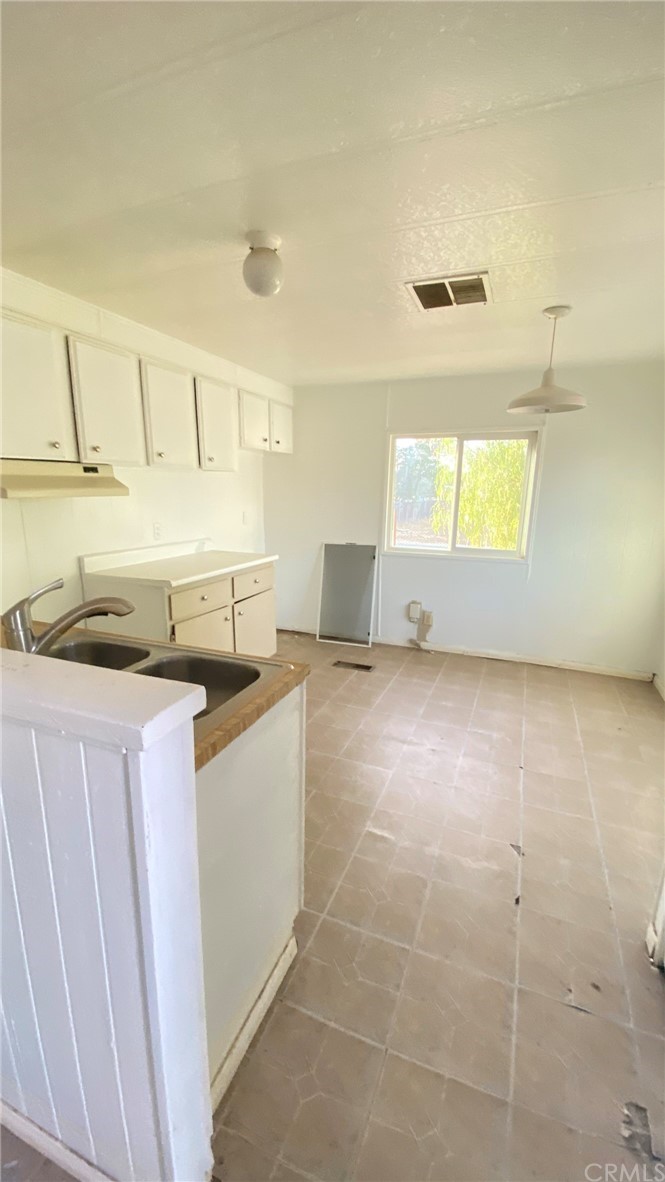 20455 Hunter Street Perris, CA 92570 - Photo 23 of 35 a kitchen with a sink cabinets and a window