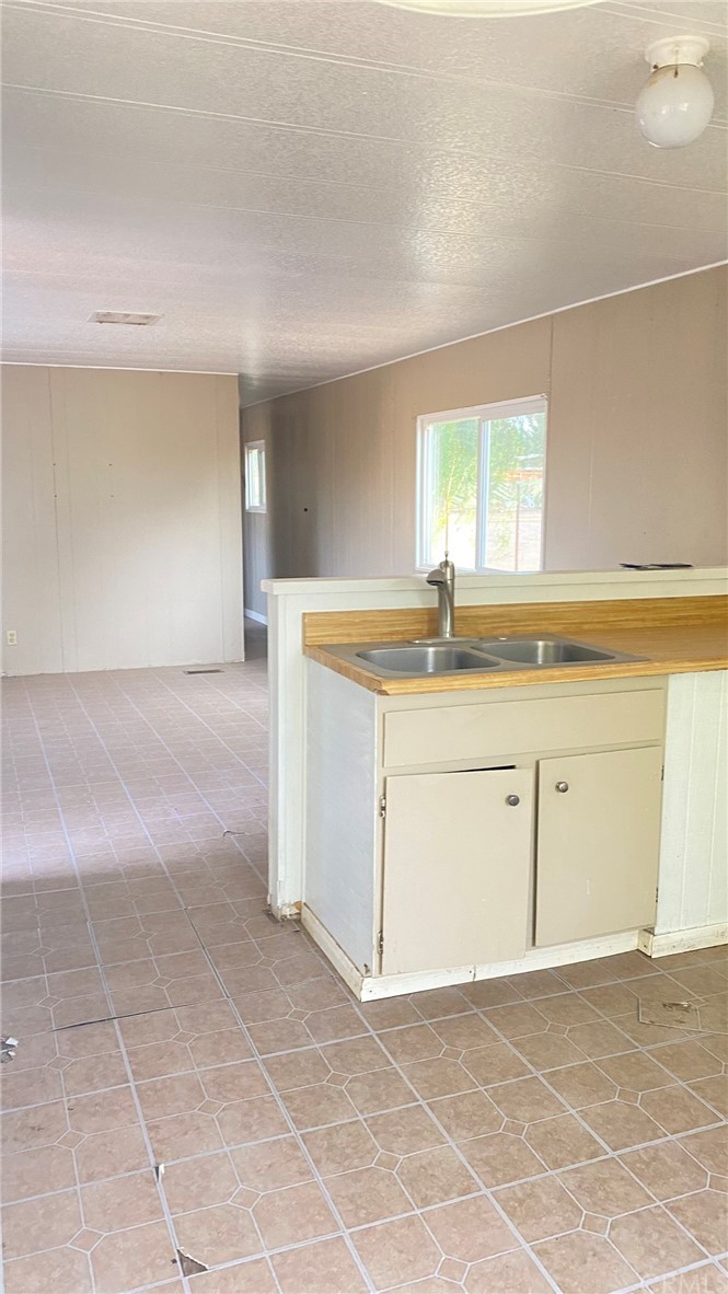 20455 Hunter Street Perris, CA 92570 - Photo 28 of 35 a view of a kitchen with a sink and dishwasher with a stove