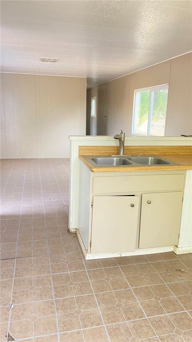 20455 Hunter Street Perris, CA 92570 - Photo 29 of 35 a view of a kitchen with a sink a vanity and a window