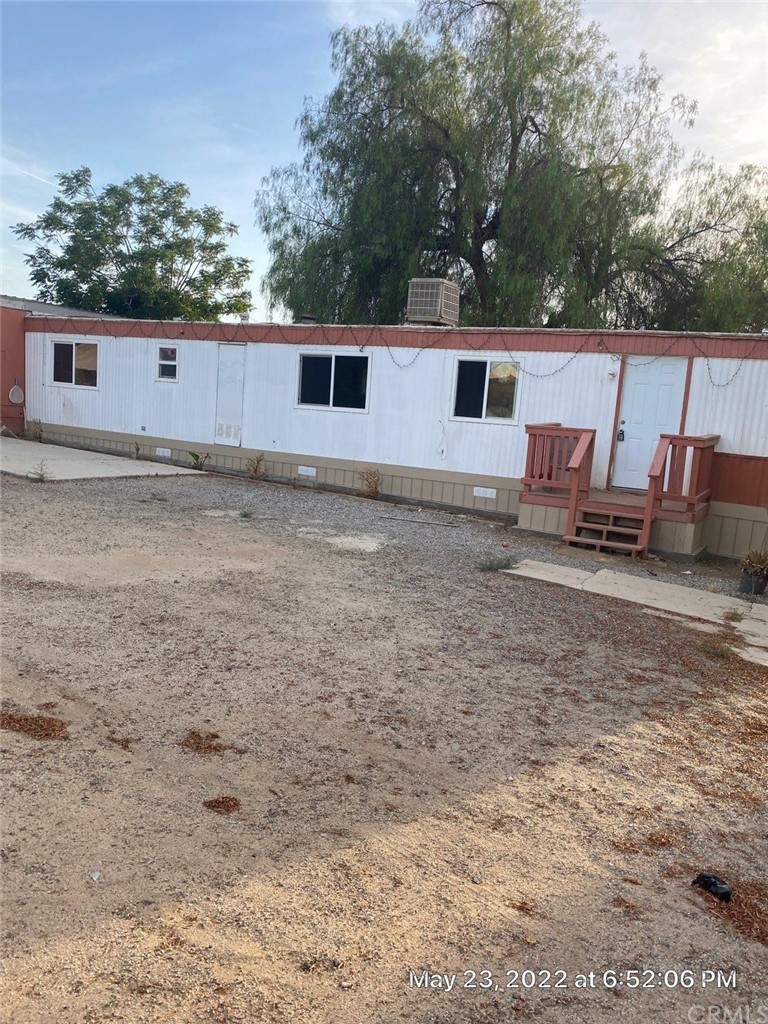 20455 Hunter Street Perris, CA 92570 - Photo 31 of 35 front view of a house with a yard