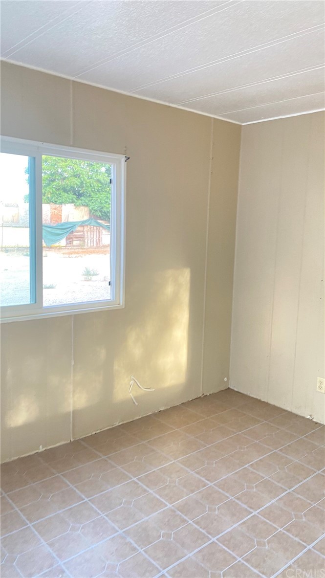 20455 Hunter Street Perris, CA 92570 - Photo 5 of 35 an empty room with a window