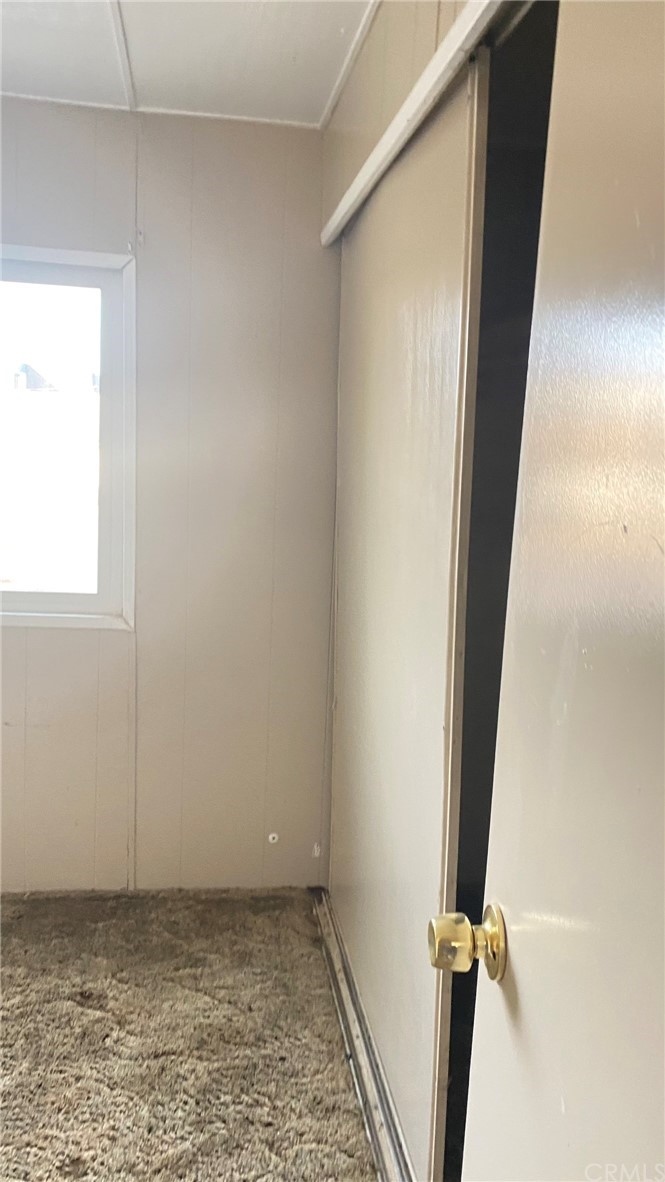20455 Hunter Street Perris, CA 92570 - Photo 9 of 35 an empty room with a door