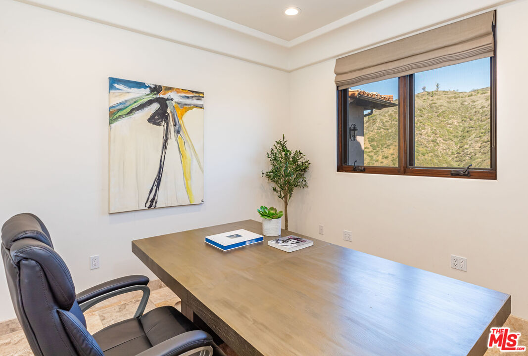 4800 Latigo Canyon Road Malibu, CA 90265 - Photo 12 of 56 a view of a workspace with furniture and a window