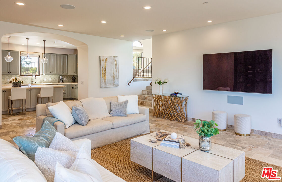 4800 Latigo Canyon Road Malibu, CA 90265 - Photo 15 of 56 a living room with furniture kitchen view and a wooden floor