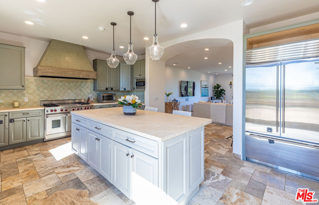4800 Latigo Canyon Road Malibu, CA 90265 - Photo 18 of 56 a large kitchen with kitchen island a large island in it