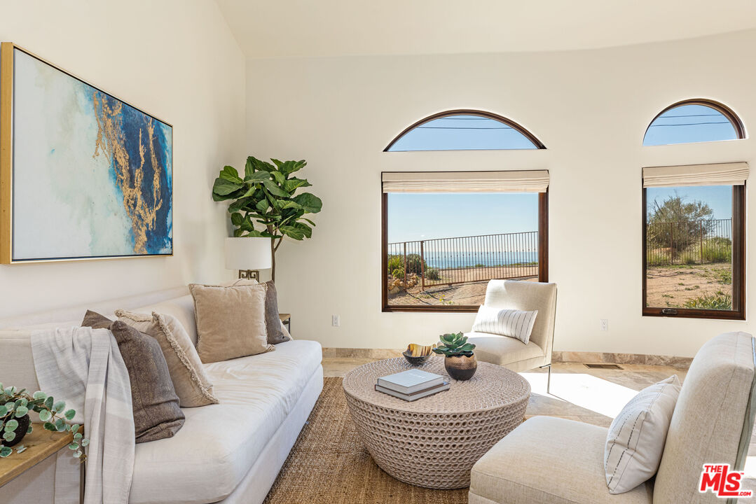 4800 Latigo Canyon Road Malibu, CA 90265 - Photo 19 of 56 a living room with furniture and a painting