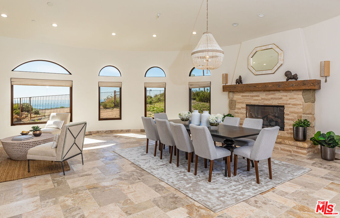 4800 Latigo Canyon Road Malibu, CA 90265 - Photo 20 of 56 a view of a dining room with furniture window and wooden floor