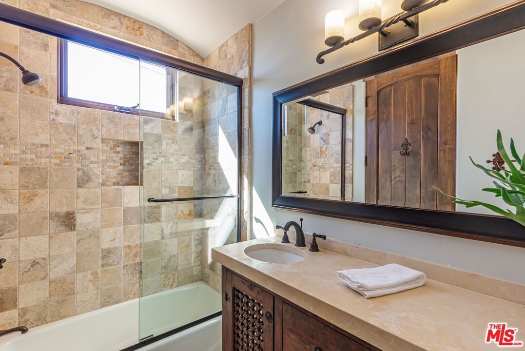 4800 Latigo Canyon Road Malibu, CA 90265 - Photo 24 of 56 a bathroom with a granite countertop sink and a mirror