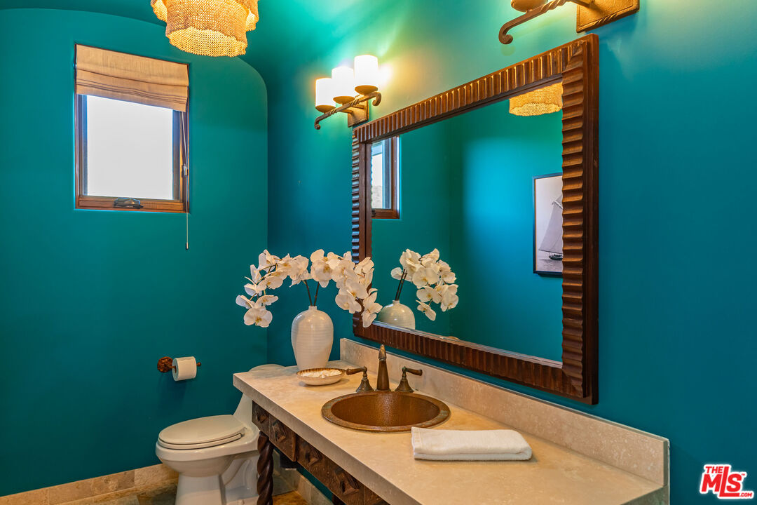 4800 Latigo Canyon Road Malibu, CA 90265 - Photo 25 of 56 a bathroom with a sink mirror and toilet