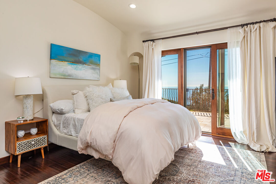 4800 Latigo Canyon Road Malibu, CA 90265 - Photo 32 of 56 a bedroom with a bed and a window
