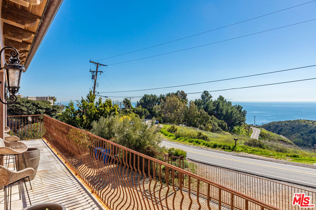 4800 Latigo Canyon Road Malibu, CA 90265 - Photo 36 of 56 a view of a balcony with wooden floor