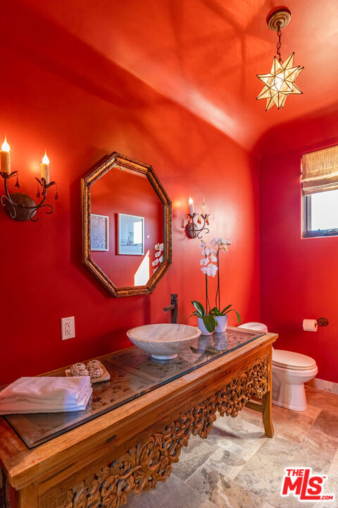 4800 Latigo Canyon Road Malibu, CA 90265 - Photo 39 of 56 a bedroom with a bed and a lamp with the potted plant