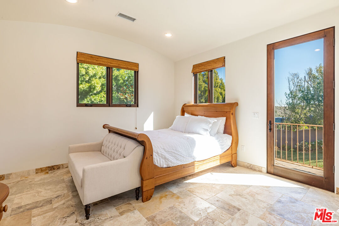 4800 Latigo Canyon Road Malibu, CA 90265 - Photo 50 of 56 a bedroom with furniture and a window