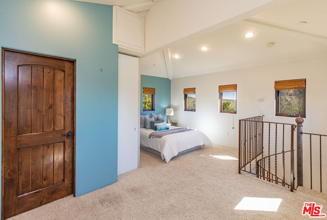 4800 Latigo Canyon Road Malibu, CA 90265 - Photo 54 of 56 a living room with furniture and wooden floor